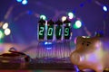 Happy new year is written with a lamp light. Radio electronic lamps. 2019. Symbol of the year pig. Original designed