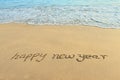 Happy new year in the sand Royalty Free Stock Photo