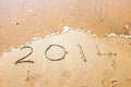 Happy New Year, 2014 written in sand Royalty Free Stock Photo