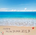 Happy new year 2017 written in the sand
