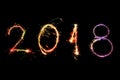 Happy new year 2018 written with Sparkle firework on black background, Royalty Free Stock Photo