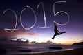 Happy new year 2015.young man jumping and drawing 2015 Royalty Free Stock Photo