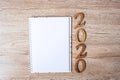 2020 Happy New years with blank notebook for text and wooden number on table and copy space. New Start, Resolution, Goals and Royalty Free Stock Photo