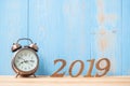 2019 Happy New years with retro alarm clock and wooden number on table and copy space. Royalty Free Stock Photo