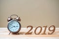 2019 Happy New years with retro alarm clock and wooden number on table and copy space. New Start, Resolution, Goals and Mission Royalty Free Stock Photo