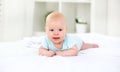 Happy newborn baby on bed Royalty Free Stock Photo