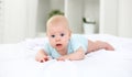 Happy newborn baby on bed Royalty Free Stock Photo