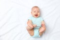 Happy newborn baby on bed Royalty Free Stock Photo