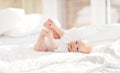 Happy newborn baby on bed Royalty Free Stock Photo