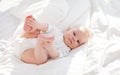 Happy newborn baby on bed