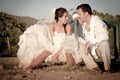 Happy newly wed couple sitting on round about playground Royalty Free Stock Photo