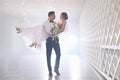 Happy newlywed couple dancing in festive hall Royalty Free Stock Photo