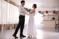 Happy newlywed couple dancing in festive hall Royalty Free Stock Photo