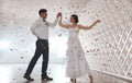 Happy newlywed couple dancing in festive hall Royalty Free Stock Photo