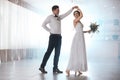 Happy newlywed couple dancing in festive hall Royalty Free Stock Photo