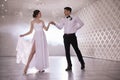 Happy newlywed couple dancing in festive hall Royalty Free Stock Photo
