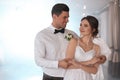 Happy newlywed couple dancing together in hall Royalty Free Stock Photo