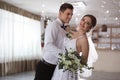 Happy newlywed couple dancing together in hall Royalty Free Stock Photo