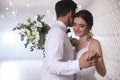 Happy newlywed couple dancing together in hall Royalty Free Stock Photo