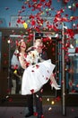 Happy newlyweds bride and groom with petals