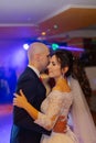 Happy newlyweds dance on the dance floor the first dance.