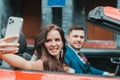 Happy newlyweds go to the celebration in a red car with an open top. Wedding Concept Royalty Free Stock Photo