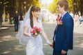 Happy newlyweds in the green park