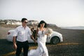 Happy newlyweds near the car Royalty Free Stock Photo