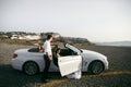 Happy newlyweds near the car Royalty Free Stock Photo