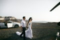 Happy newlyweds near the car Royalty Free Stock Photo