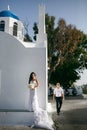 Happy newlyweds possing near the church Royalty Free Stock Photo