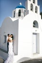 Happy newlyweds possing near the church Royalty Free Stock Photo