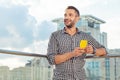 Happy nice man holding his new smartphone Royalty Free Stock Photo