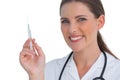 Happy nurse holding a syringe and smiling Royalty Free Stock Photo