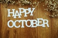 Happy October alphabet letters text on wooden background
