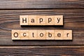 Happy october word written on wood block. Happy october text on table, concept Royalty Free Stock Photo