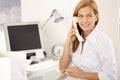 Happy office girl on landline phone call Royalty Free Stock Photo