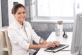 Happy office girl working on computer