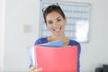 Happy office worker holding forward folders Royalty Free Stock Photo