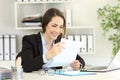 Happy office worker reading a letter