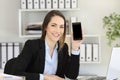 Office worker showing a phone creen mockup