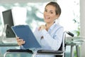happy office worker in wheelchair Royalty Free Stock Photo