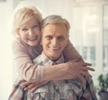 Glad mature couple standing in embrace Royalty Free Stock Photo