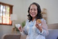 Happy old asian woman eating fresh green salad. Senior woman good healthy at home. Exercise and healthy diet concept Royalty Free Stock Photo