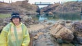 Happy Old asian women wear a rain roat and travel in taipei Yehliu geopark in rainy day Royalty Free Stock Photo