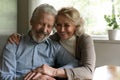 Happy old couple enjoy maturity together at home