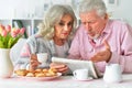 happy old couple reading newspaper during breakfast Royalty Free Stock Photo