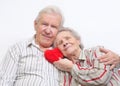 Happy old couple with red heart Royalty Free Stock Photo