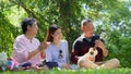 Happy old elderly couple spouses relaxing and sitting on a blanket in the park and sharing few precious memories. Senior couple Royalty Free Stock Photo