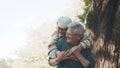 Happy old enjoying day in park. Senior man flirting with elderly woman. Dance in autumn day Royalty Free Stock Photo